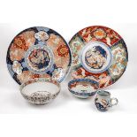 Two similar Imari chargers together with three further items of Imari porcelain