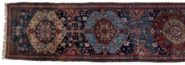 An early 20th century hand-woven Heriz runner