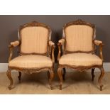 A pair of 18th century, possibly Portuguese, Colonial hardwood open armchairs