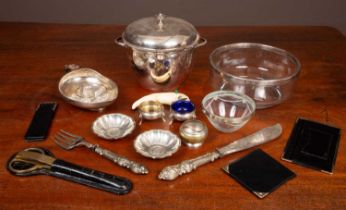 A collection of silver and white metal items