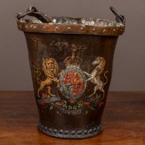 An antique fire bucket with the Royal Coat of Arms