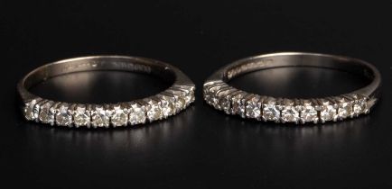 A pair of diamond half hoop rings