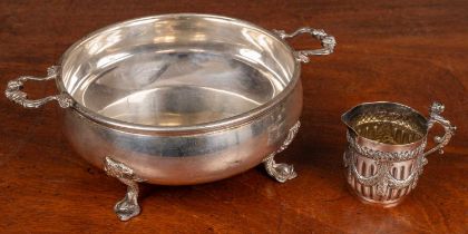 A white metal plated cup and a silver plated dish