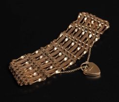 a 9ct gold gate link bracelet with a padlock clasp