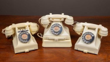 Three cream Bakelite telephones
