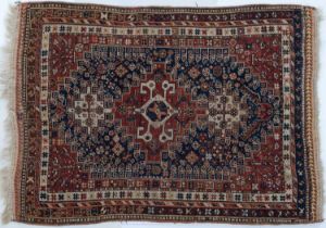 An early 20th century hand woven Quashqai rug