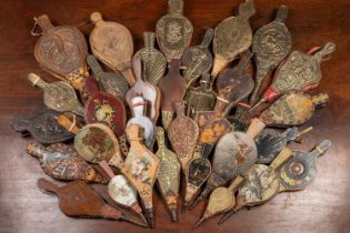 A collection of approximately thirty miniature bellows