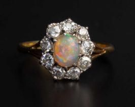 An opal and diamond cluster ring