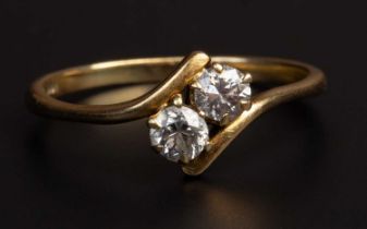 A diamond two stone cross over ring