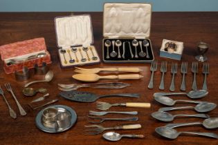 An assortment of silver and silver plated cutlery