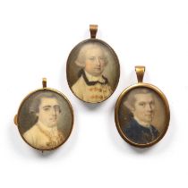 18th century English school A group of three miniature oval portraits, the first of a gentleman in a