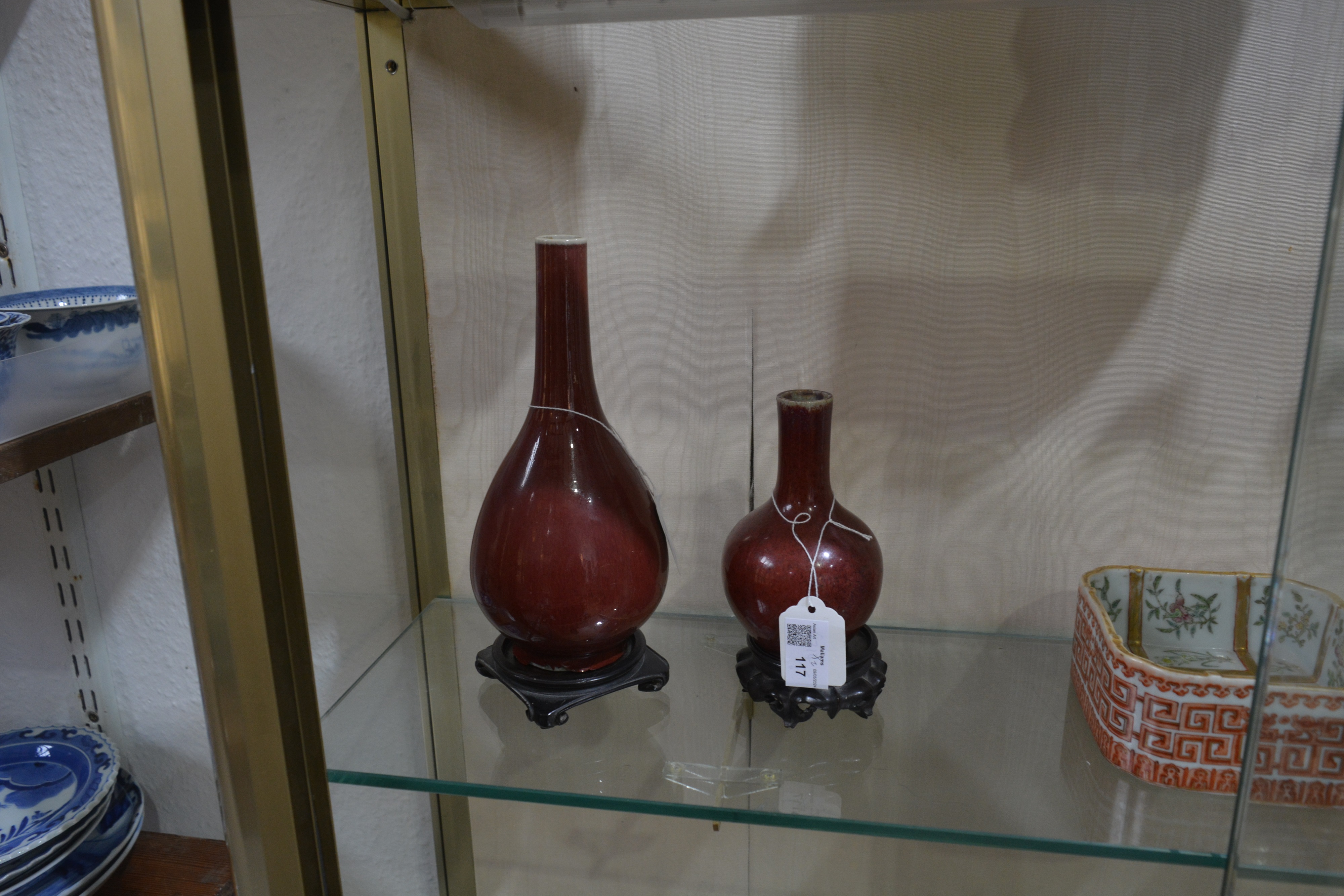 Two sang de boeuf vases on wooden stands Chinese, 18th/19th Century each of bottle vase form, 22.5cm - Image 5 of 5