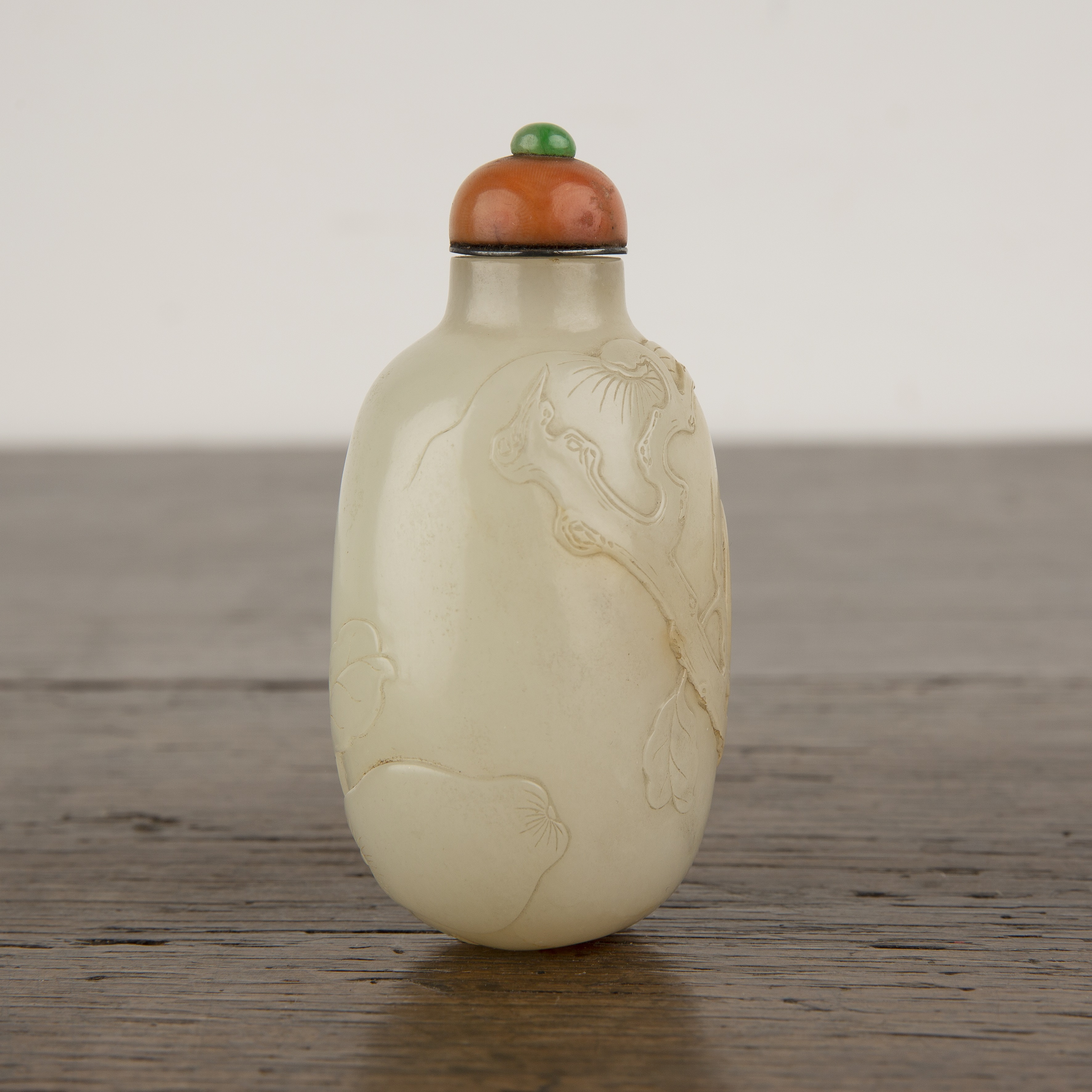 Nephrite snuff bottle Chinese, 1750-1780 of rounded elongated pebble shape carved in low relief - Image 3 of 13