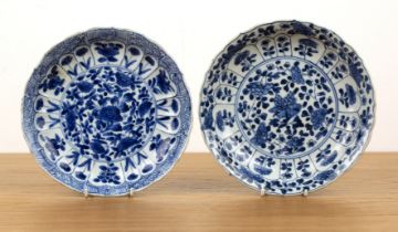 Two blue and white porcelain shallow dishes Chinese, Kangxi each of fluted form with panels of