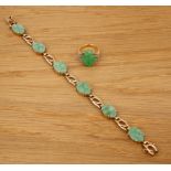 Two pieces of jade jewellery English, 20th Century the first a 9ct gold panel bracelet, set with six