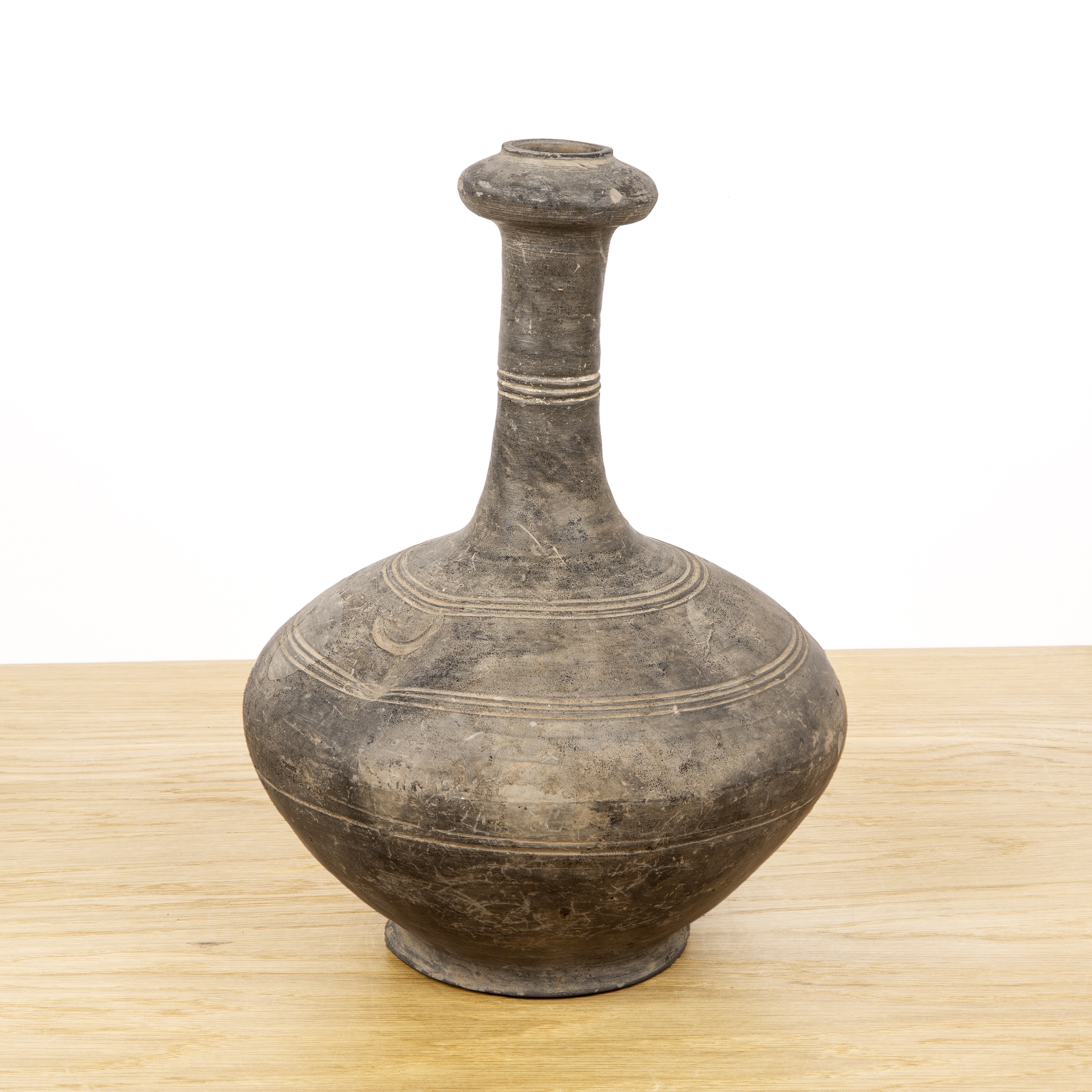 Garlic mouth funerary jar Chinese, Western Han with reeded and incised bands, 31cm high