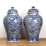 Pair of blue and white vases and covers Chinese, 19th Century with all-over trailing Indian lotus
