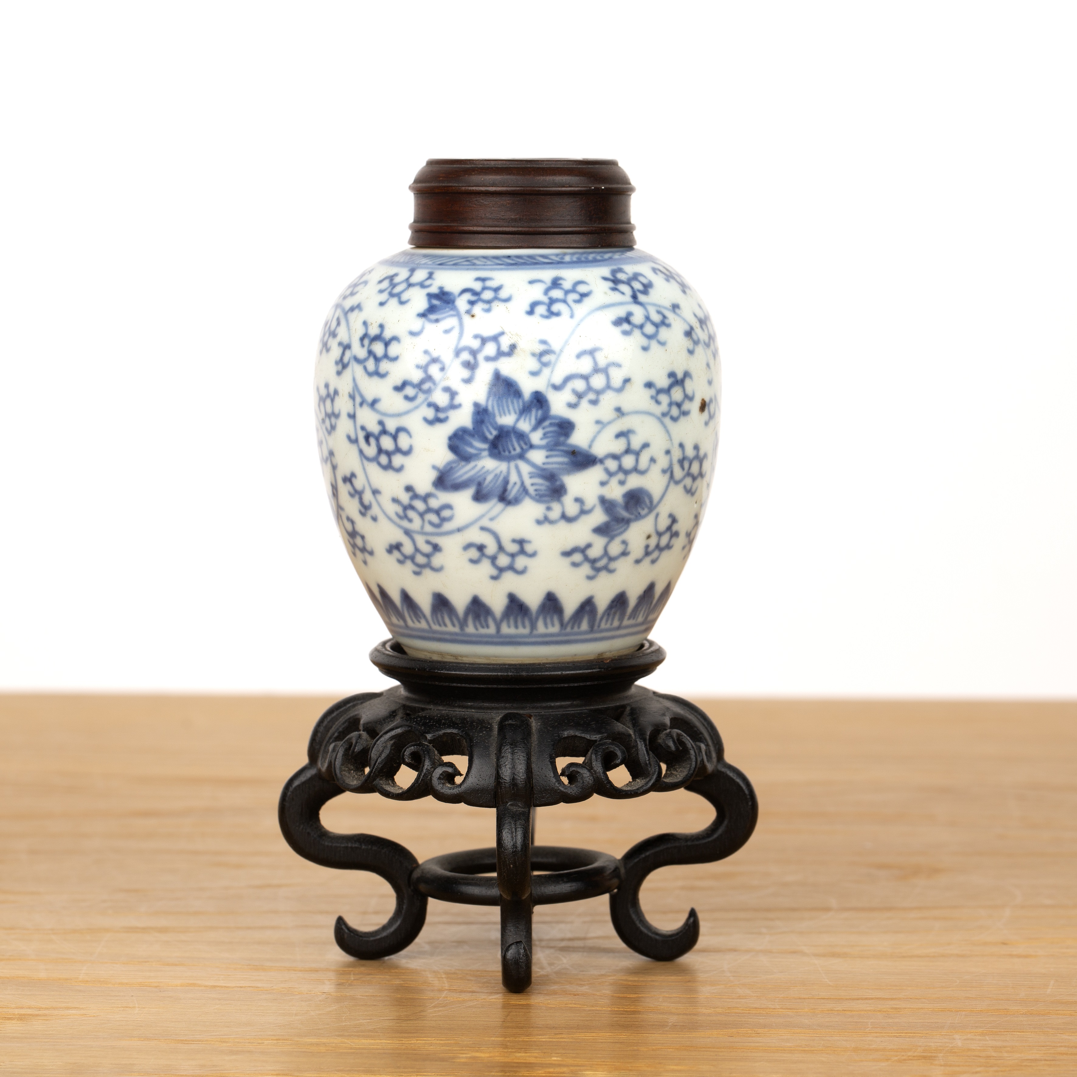 Small blue and white ginger jar with wood cover and stand Chinese, 18th/19th Century with Indian