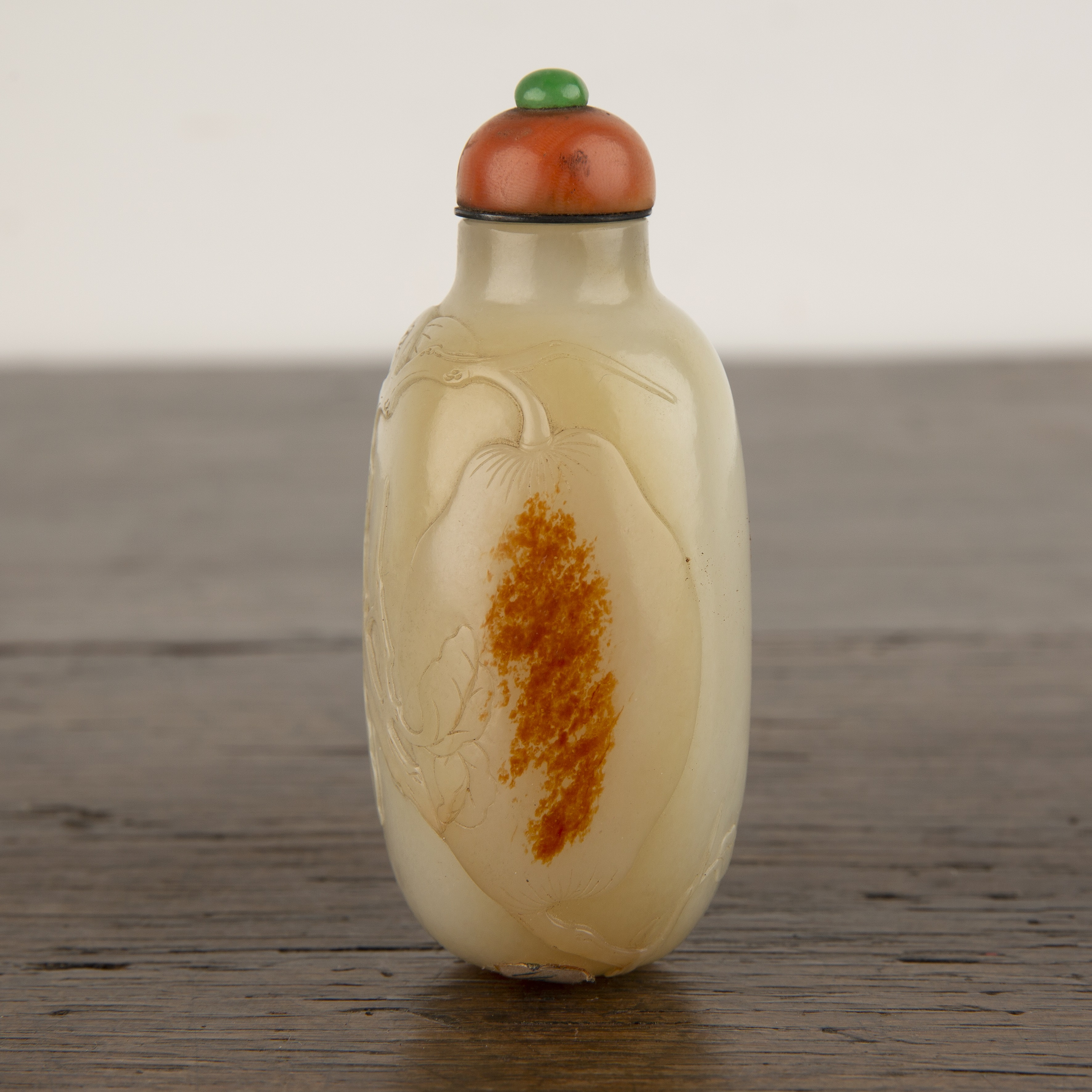 Nephrite snuff bottle Chinese, 1750-1780 of rounded elongated pebble shape carved in low relief - Image 2 of 13