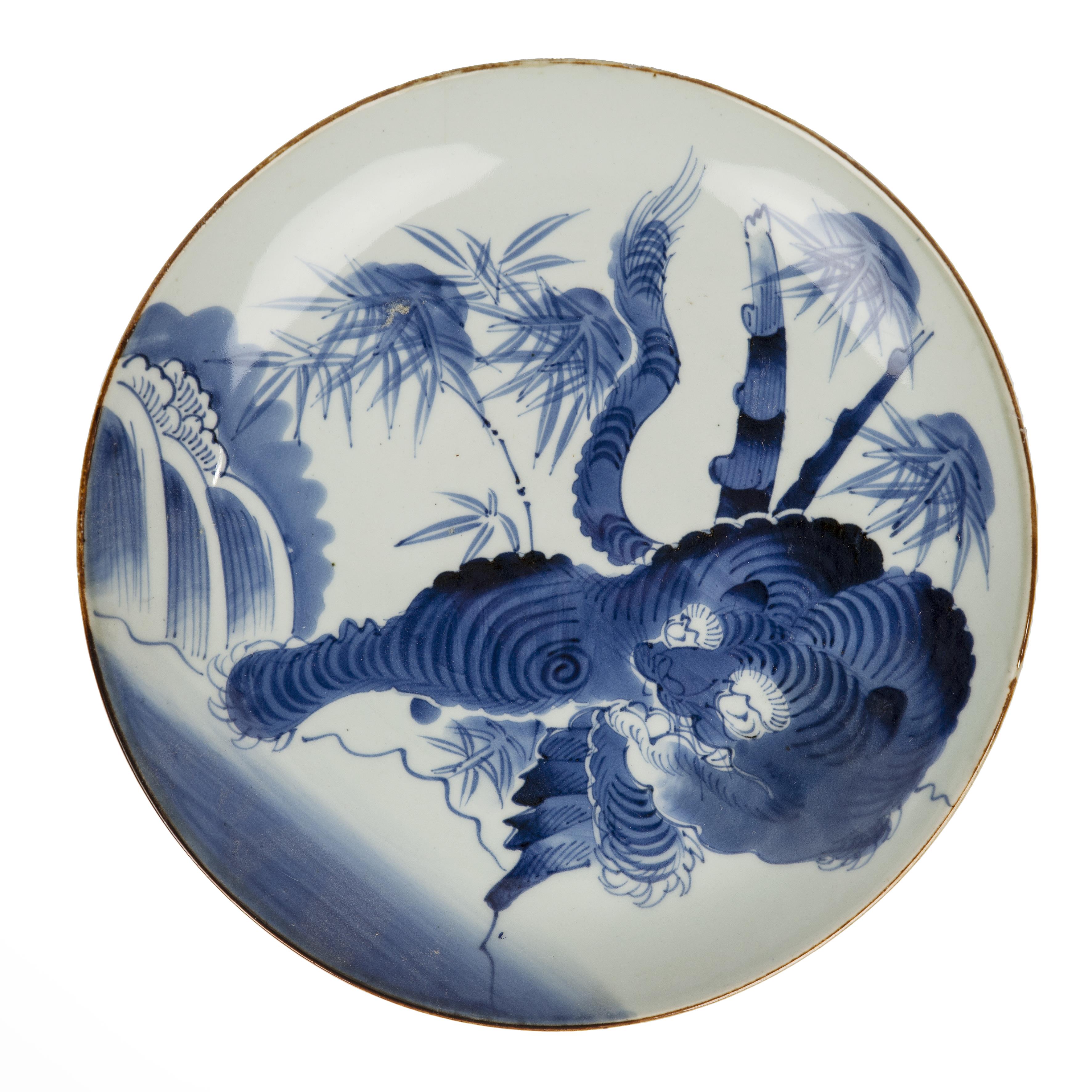 Blue and white porcelain charger Japanese painted with a tiger and bamboo, 32.7cm diameter x 4.5cm