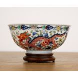 Wucai porcelain bowl Chinese painted in polychrome enamels with a central dragon and flaming pearls.
