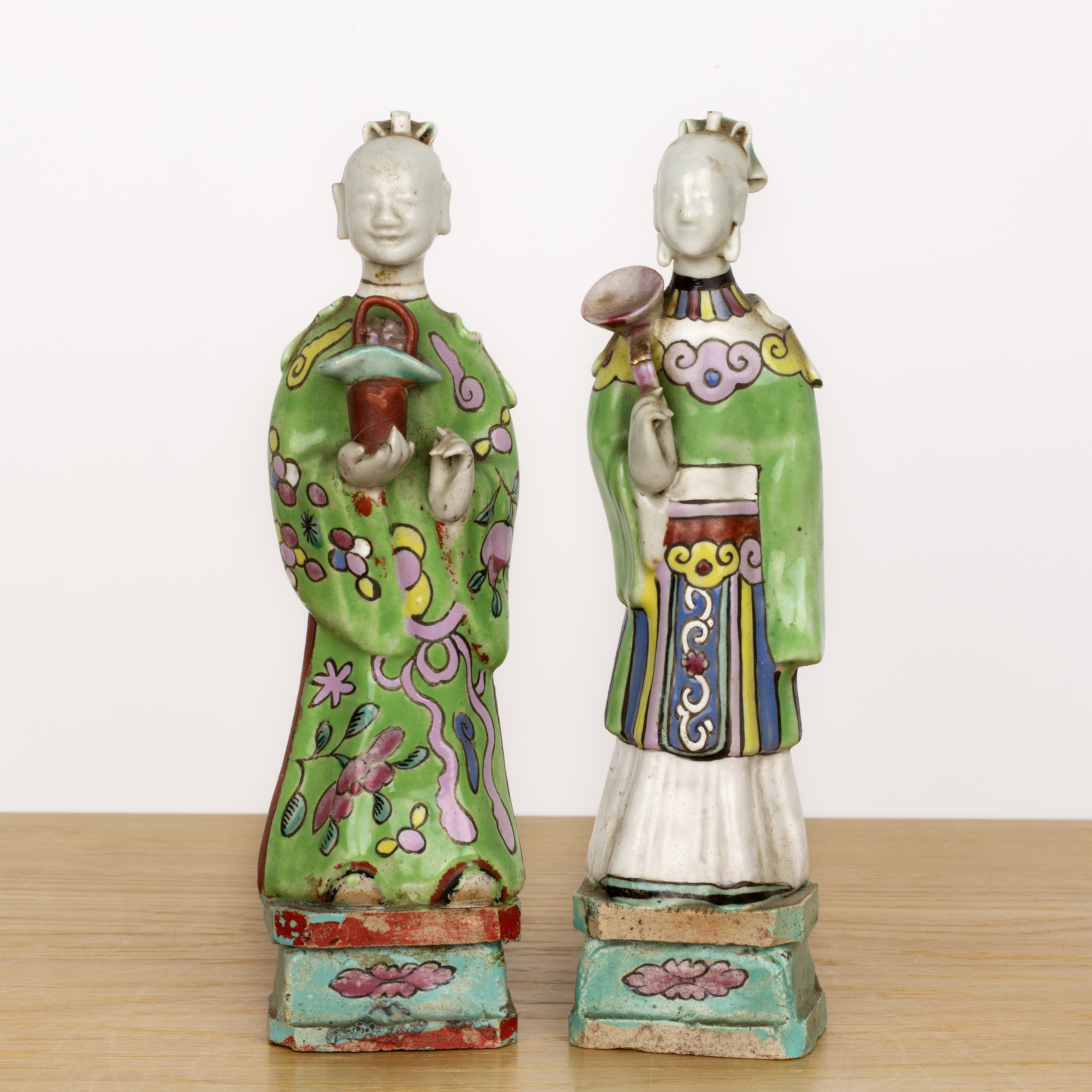 Two standing famille verte figures Chinese, 18th/19th Century each on a raised plinth base, 24cm