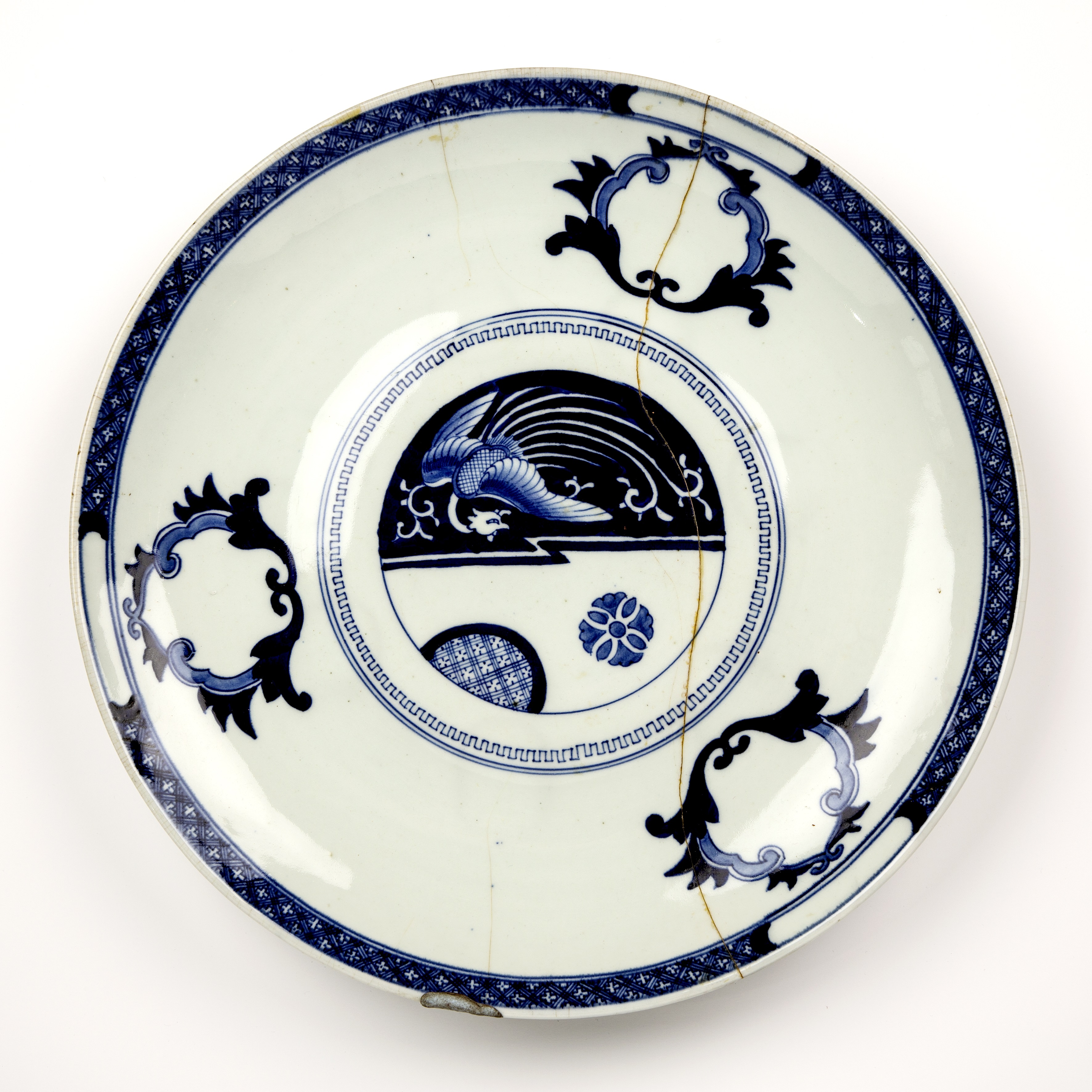 Large blue and white porcelain charger Japanese, 19th Century painted with a phoenix to the centre