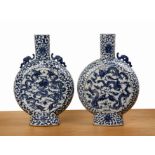 Pair of large blue and white porcelain moon flasks Chinese, 19th Century each painted with dragons