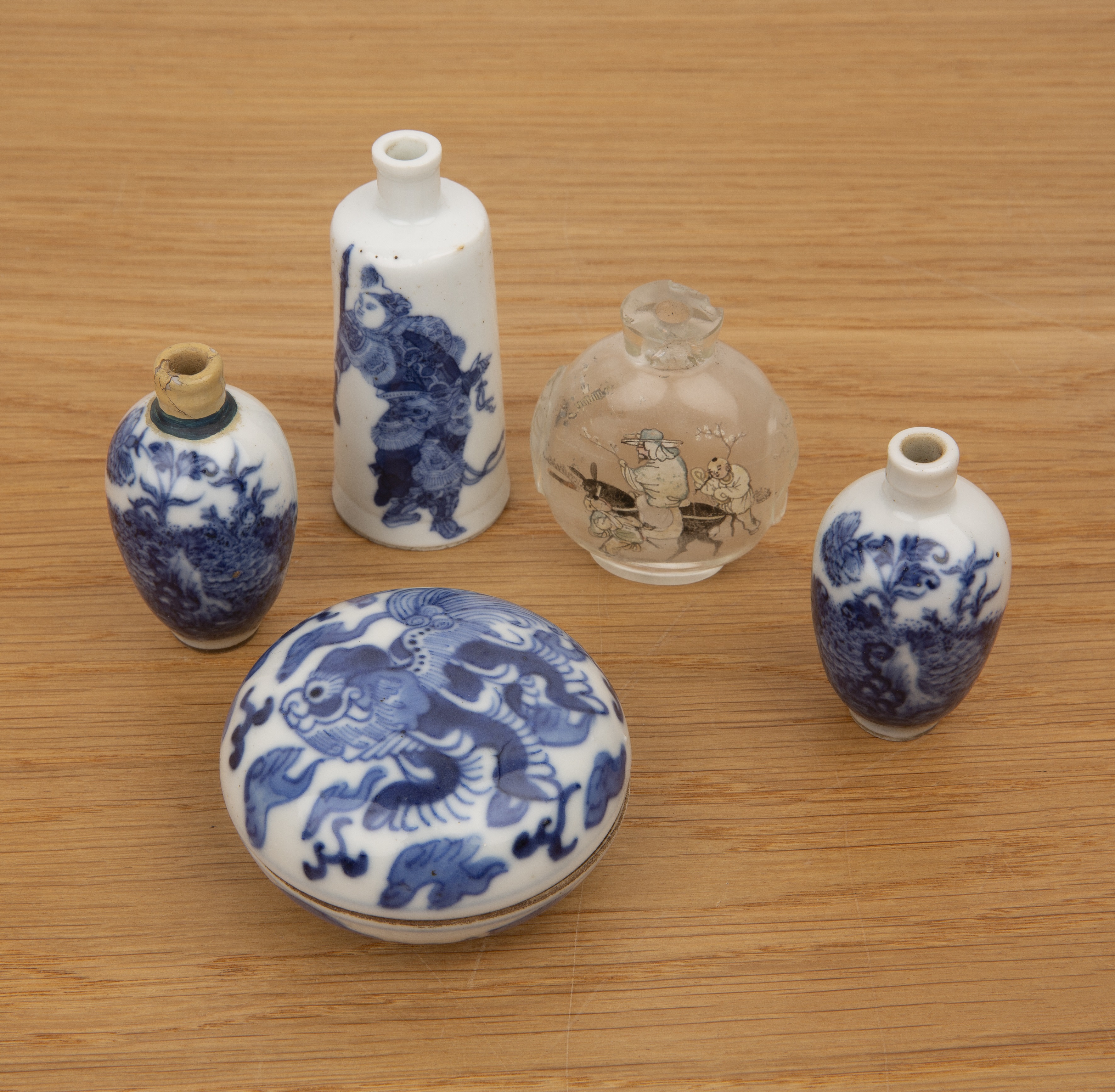 Collection of snuff bottles and ceramics Chinese, 19th Century comprising: a pair of blue and