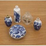 Collection of snuff bottles and ceramics Chinese, 19th Century comprising: a pair of blue and