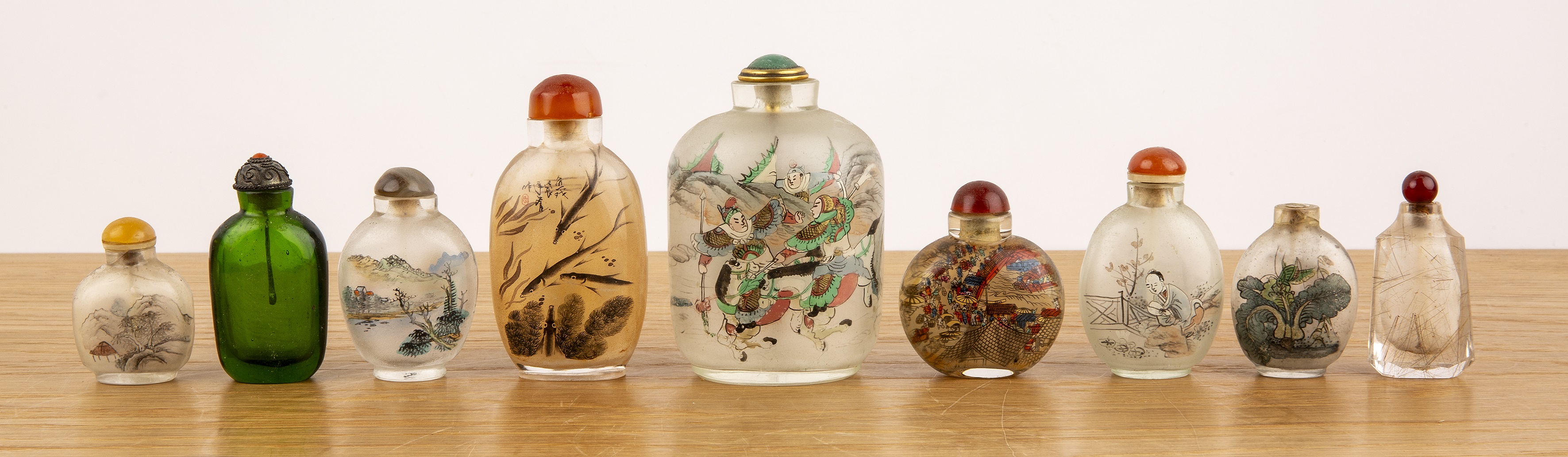Group of nine Peking glass inside painted snuff bottles Chinese including a monochrome fish-