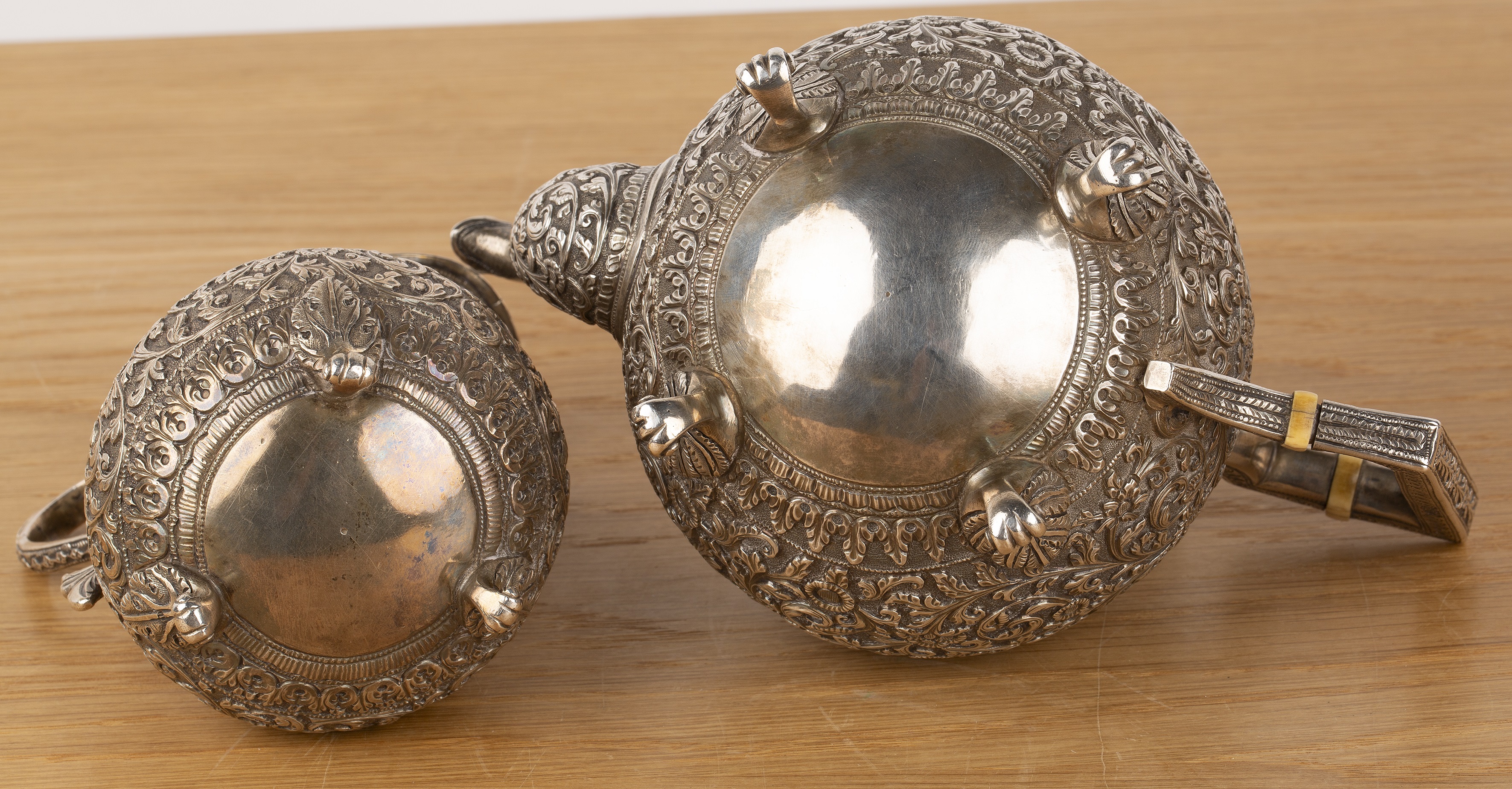 Indian Cutch teapot and similar jug late 19th Century both with chased detail throughout with - Image 3 of 4