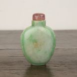 Green and white mottled jadeite snuff bottle Chinese, 1780-1850 well hollowed and of flattened ovoid