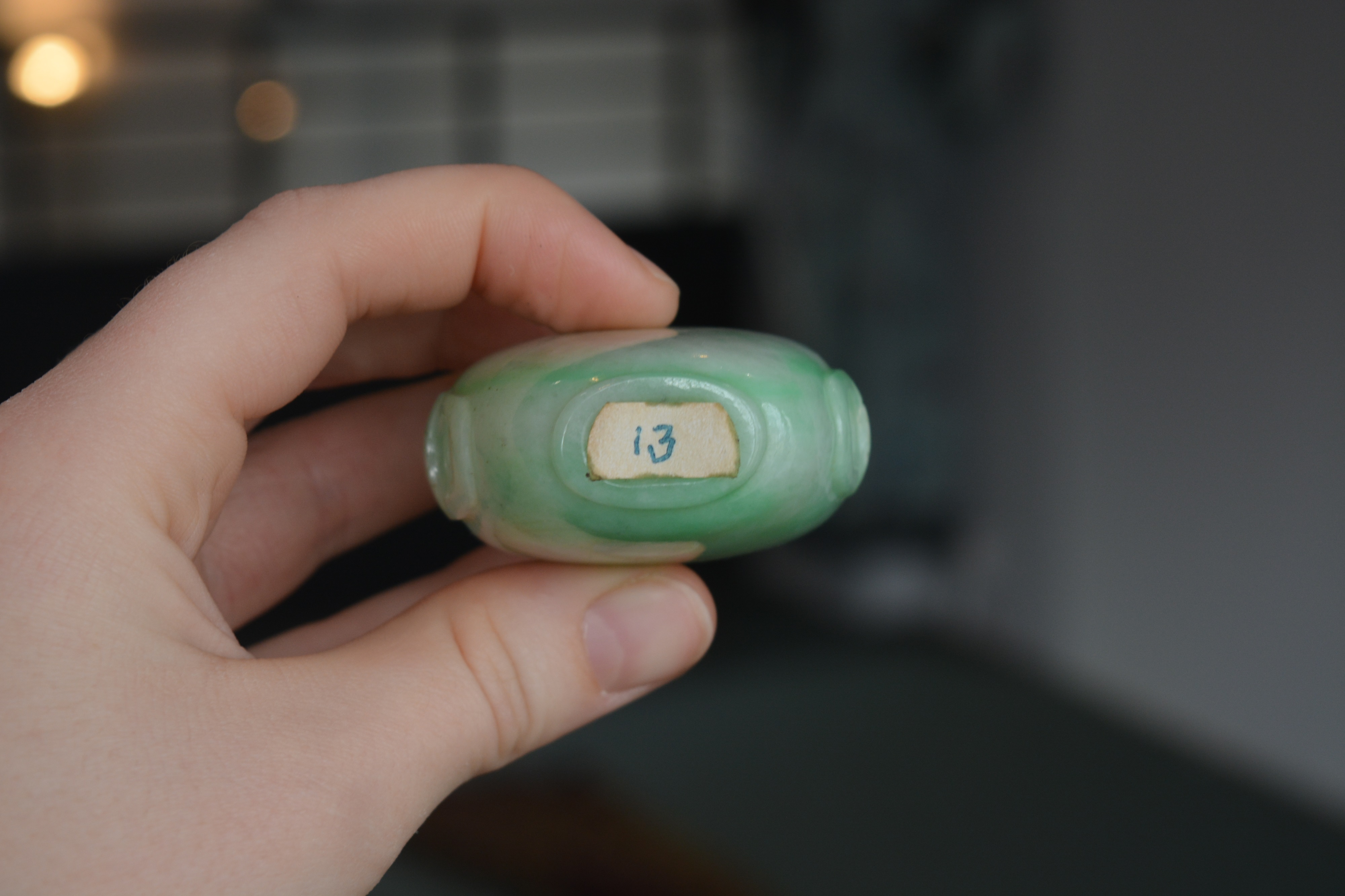 Green and white mottled jadeite snuff bottle Chinese, 1780-1850 well hollowed and of flattened ovoid - Image 10 of 12