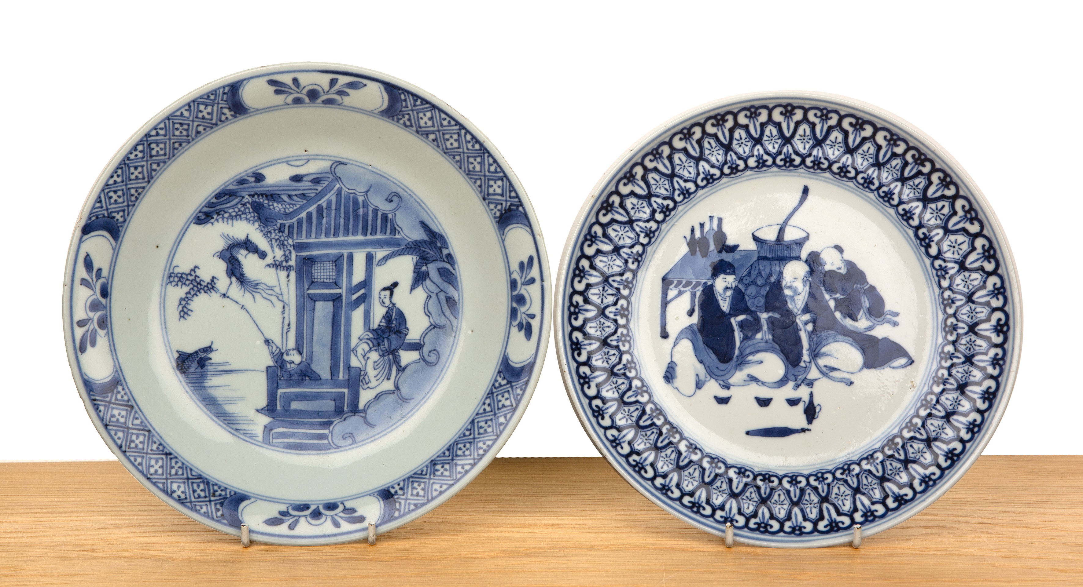 Two blue and white porcelain plates Chinese, 19th Century including a scene with a boy leaning