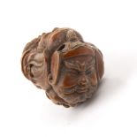 Boxwood netsuke Japanese, 19th Century carved as the heads and faces of the seven Gods of