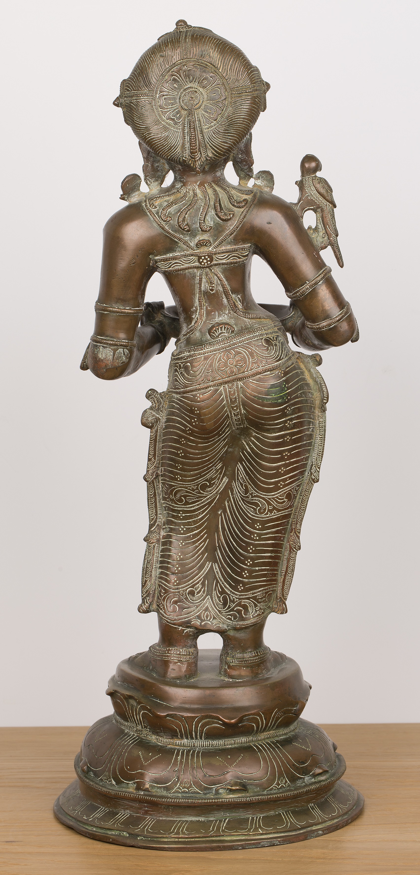 Bronze Lakshmi figure Indian with finely engraved decorated throughout, the goddess holds a dish - Image 2 of 3