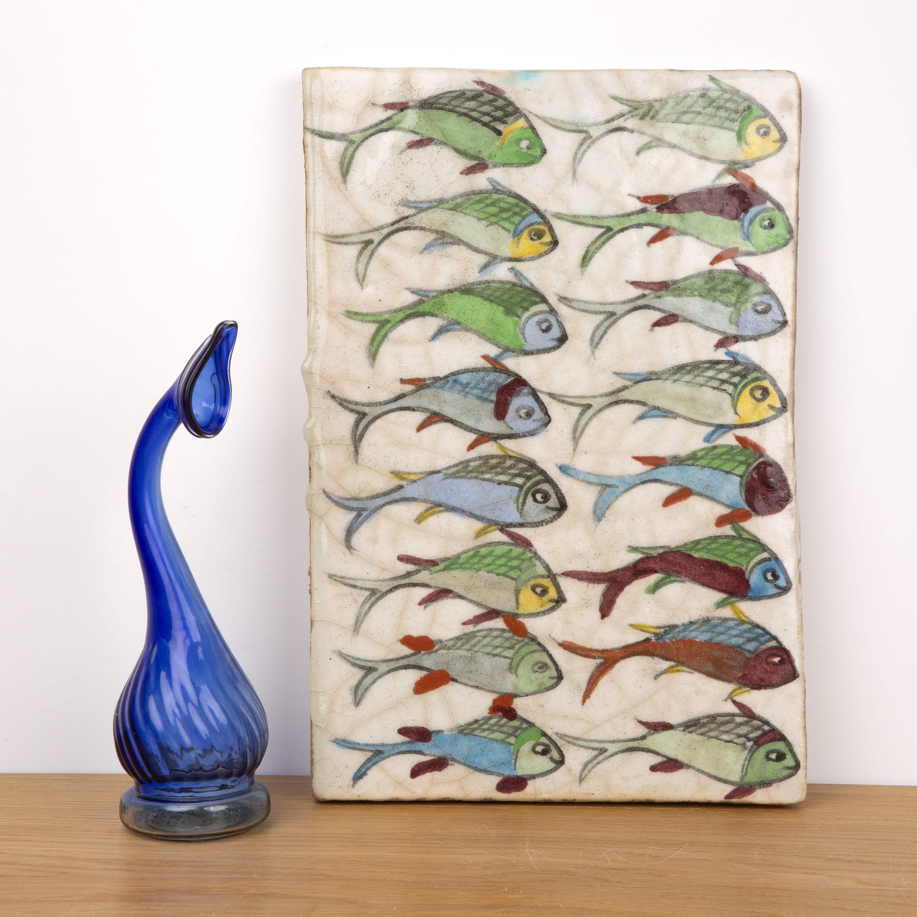 Polychrome tile Persian painted with scaled fish, 35cm long x 24cm wide x 2cm deep, together with