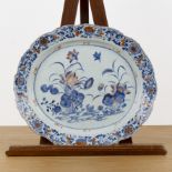 Oval porcelain serving dish Chinese, 18th Century painted with lotus flowers in blue with iron red