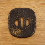 Iron tsuba Japanese, 1800-1868 of rounded square form decorated with a hammered surface on both