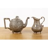 Indian Cutch teapot and similar jug late 19th Century both with chased detail throughout with