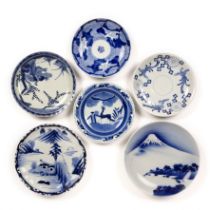 Group of Arita blue and white dishes Japanese, 19th Century variously decorated with phoenix, deer