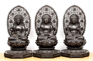 Three carved hardwood buddhas Chinese, late 19th/early 20th Century each in a contemplative mudra