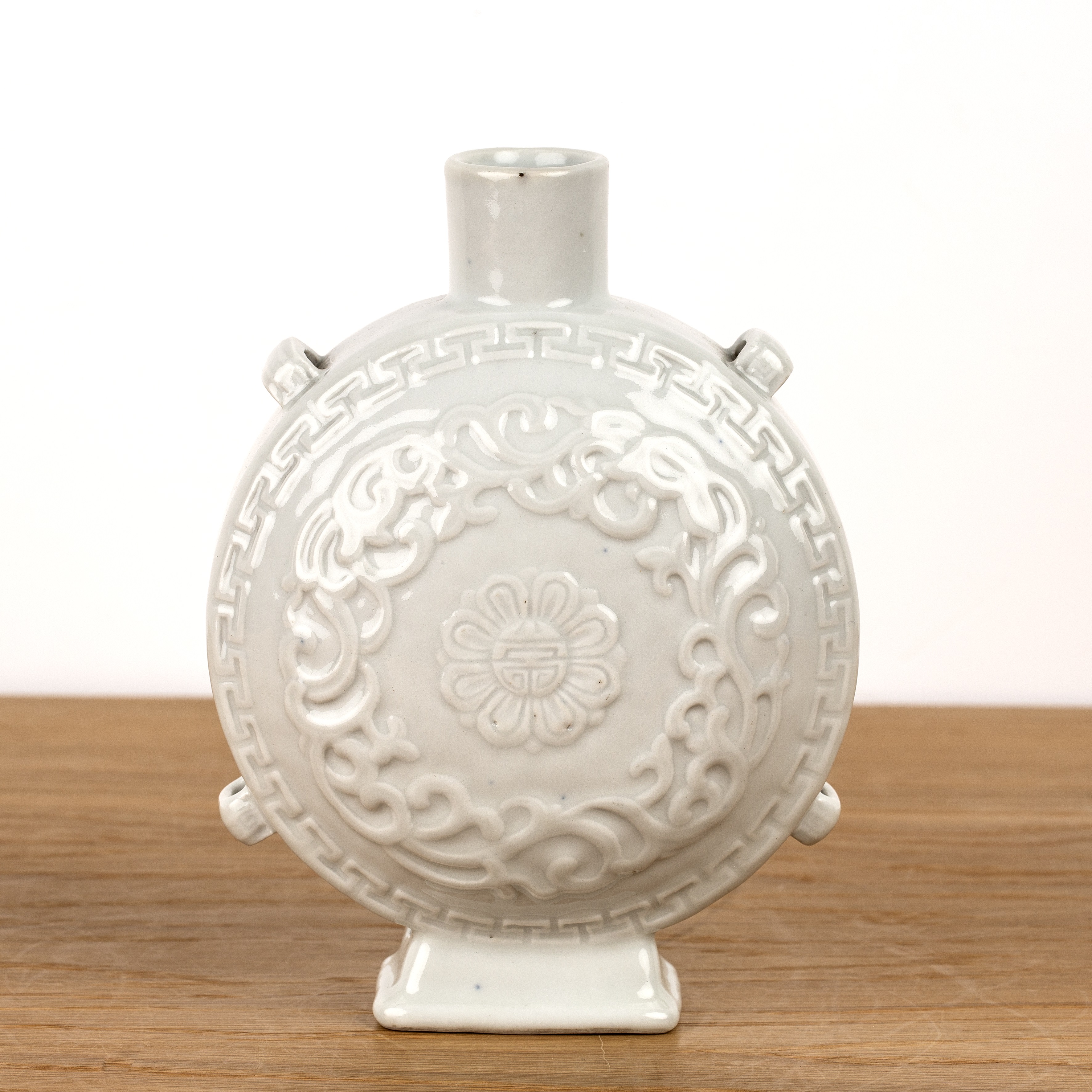 White glazed porcelain moon flask Chinese, 18th/19th Century with a central moulded flower head - Image 2 of 4