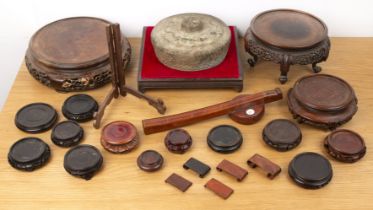 Collection of hardwood stands and a bronze gong Chinese including three larger stands, the largest