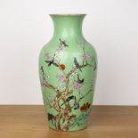 Green and enamel vase Chinese, 19th Century painted with birds and blossom on a an incised ground,