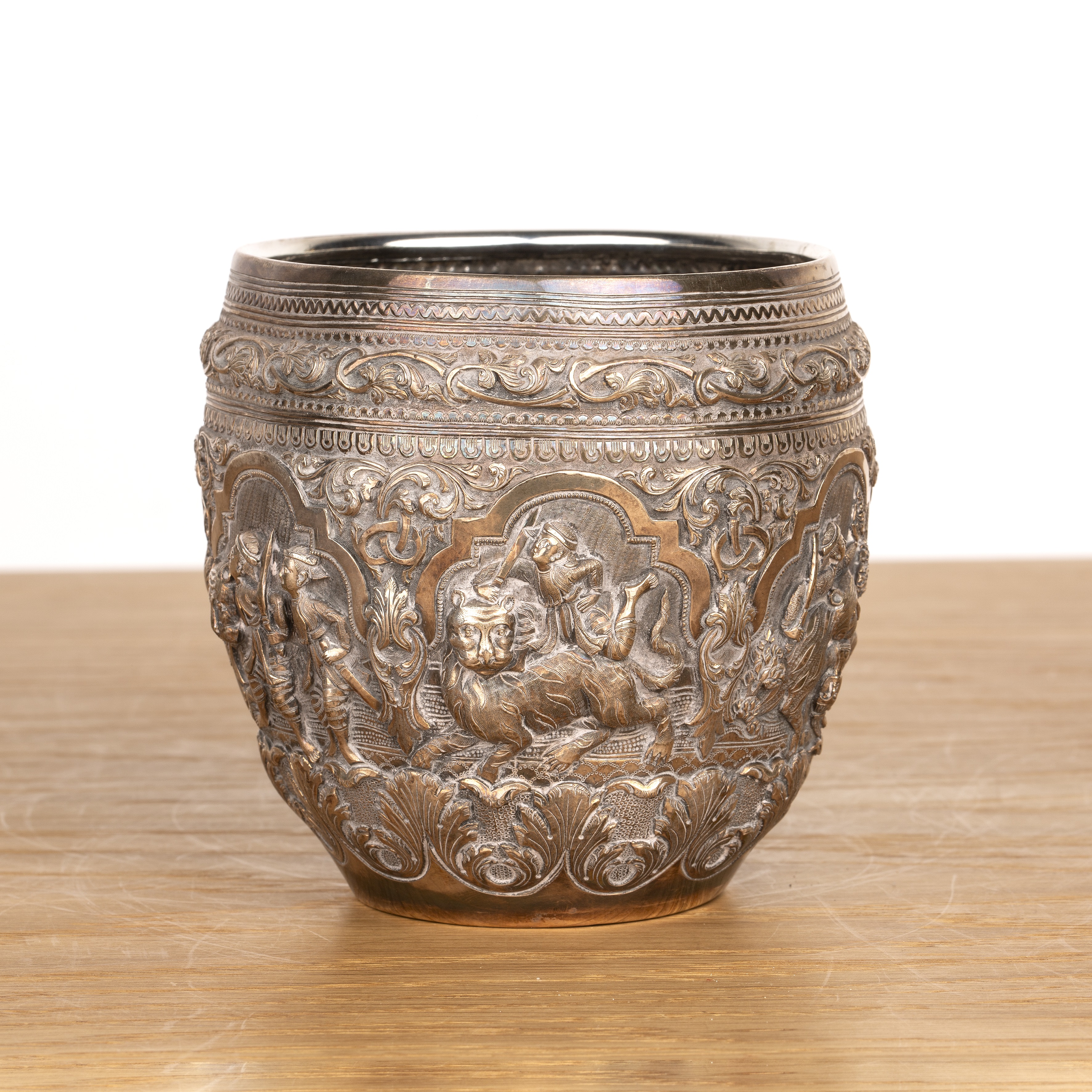 Silver repousse thabiek bowl Burmese, late 19th Century with scenes from Burmese folklore set