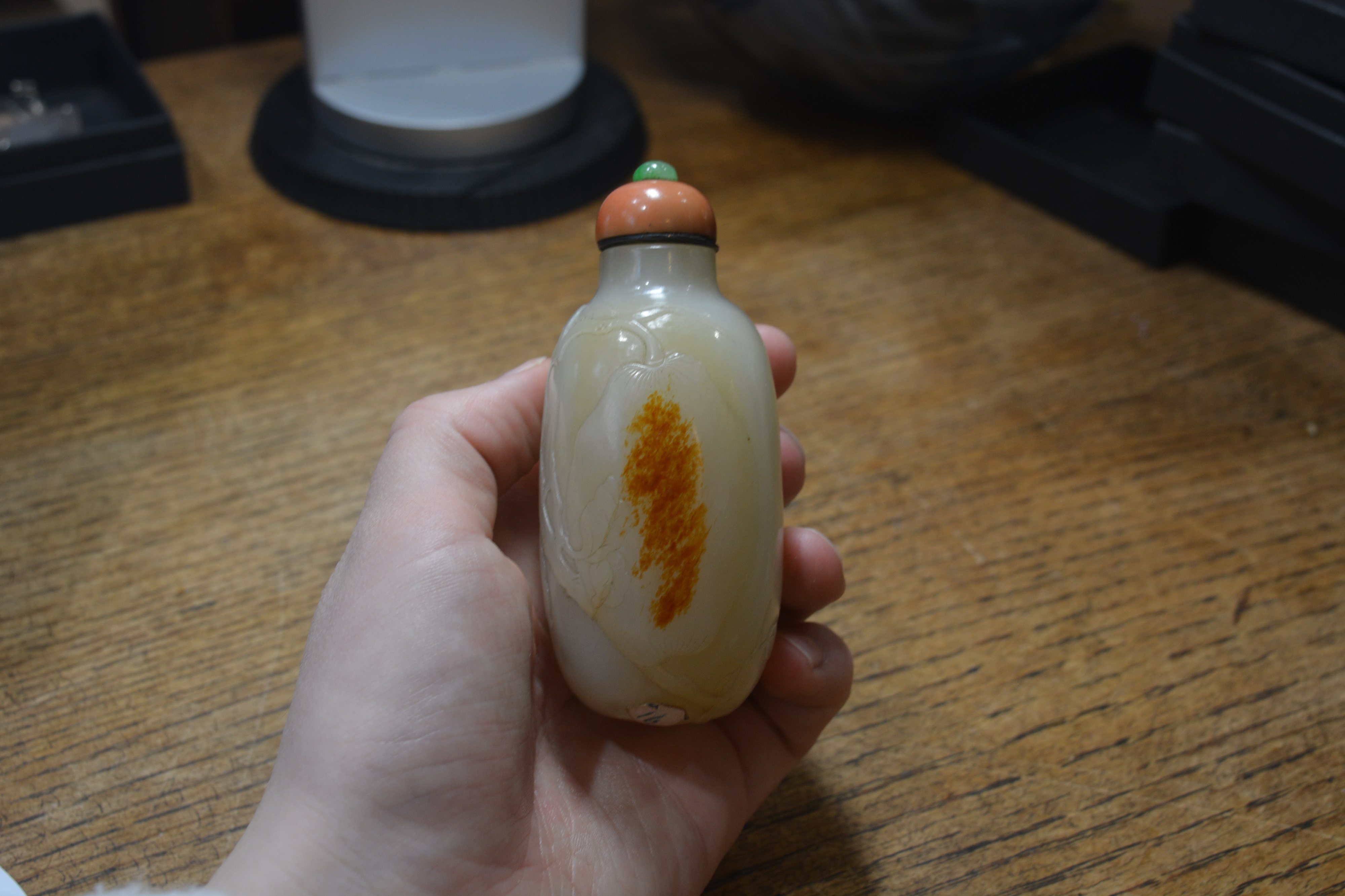 Nephrite snuff bottle Chinese, 1750-1780 of rounded elongated pebble shape carved in low relief - Image 10 of 13