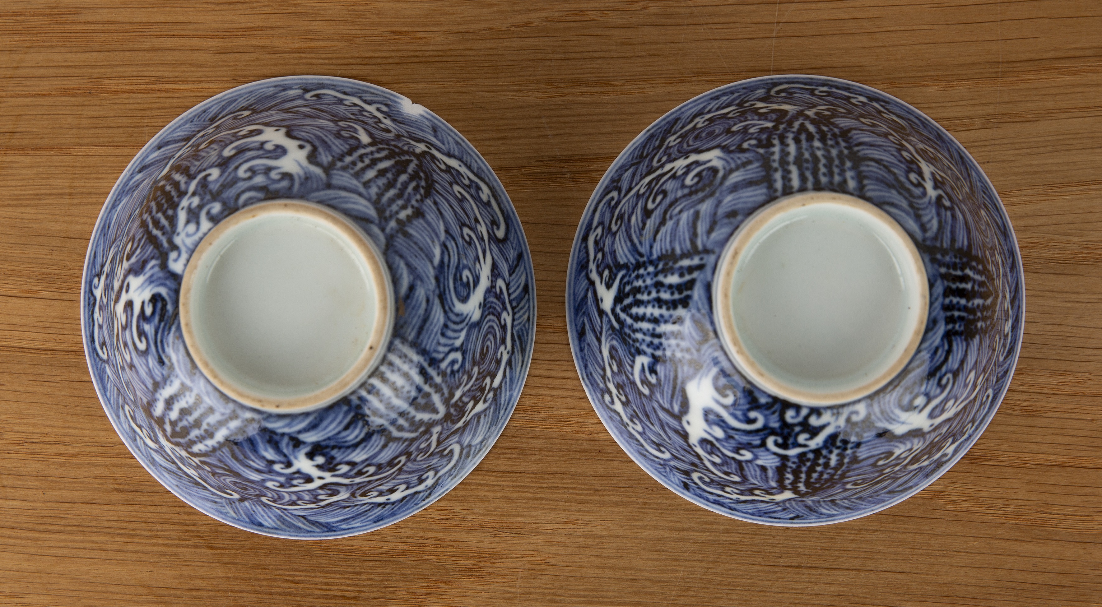 Pair of blue wave pattern bowls Chinese, 19th Century each on a raised foot with a single band, 10cm - Image 3 of 8