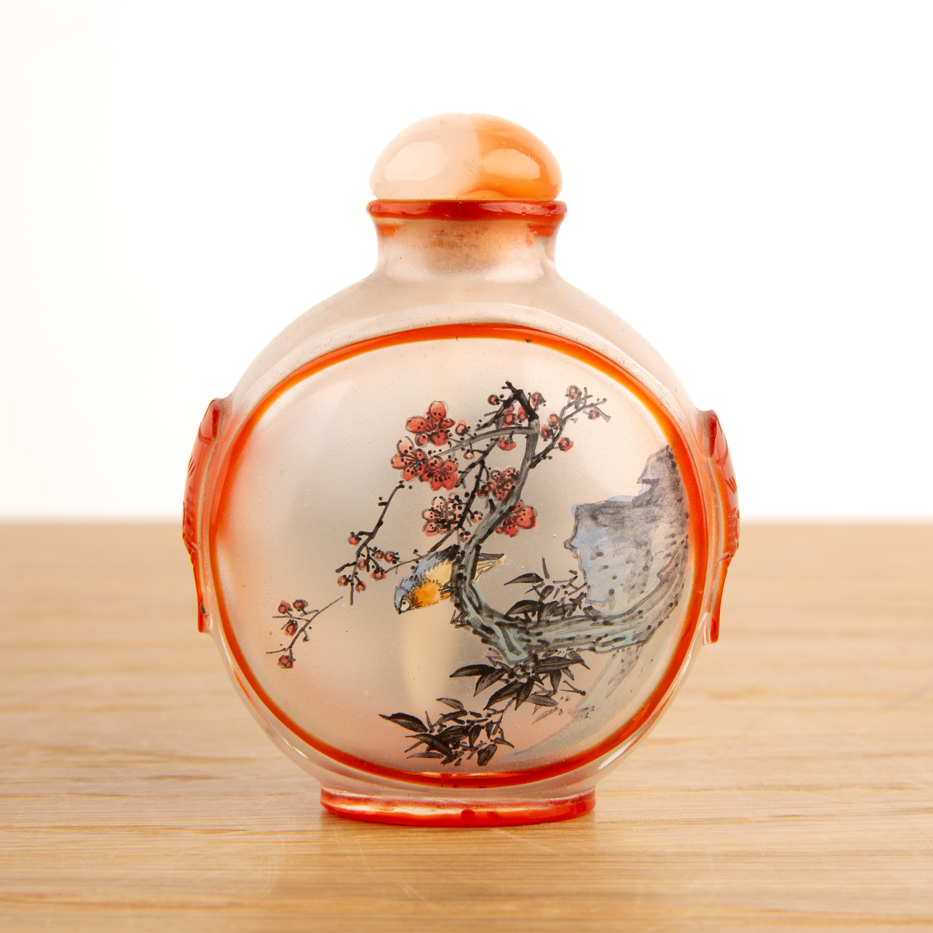 Inside painted glass snuff bottle Chinese painted with a bird resting on a branch to one side and